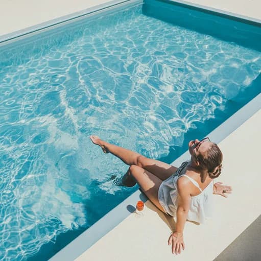 Resident relaxing at a well-kept poolside